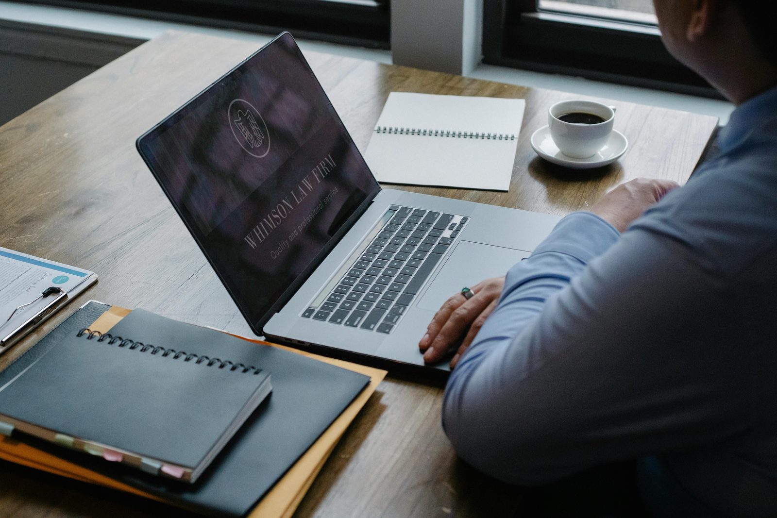 Legal professional studying on a laptop remotely
